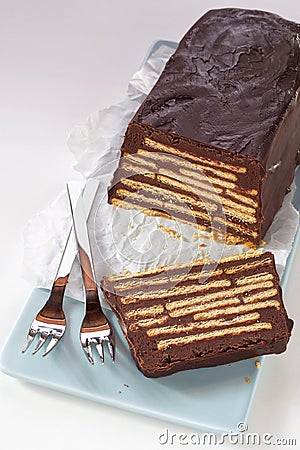Loaf-shaped chocolate cake with biscuits Stock Photo
