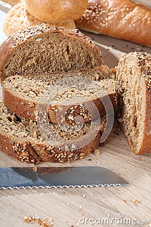 Composition with cut brown bread close up Stock Photo