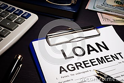 Loan agreement and money. Stock Photo