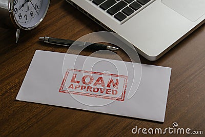 Loan approved word by rubber stamping on envelope.Loan business finance economy commercial real estate investments concept Stock Photo