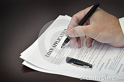 Loan Contract Document on Desk with Black Pen Stock Photo