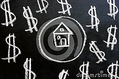 Loan and property investment. Chalk drawn house and dollar signs Stock Photo