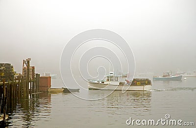 Lobster boat in fog Stock Photo