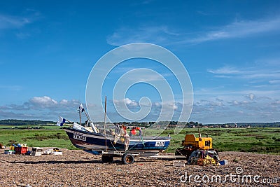 A Fisherman on a Shingle Beach Editorial Stock Photo