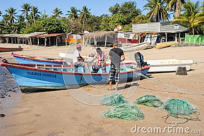 Lobster fisherman on the beach of Los Cobanos Editorial Stock Photo