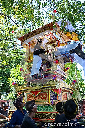 Local Balinese holy man rides the funeral pyre Editorial Stock Photo