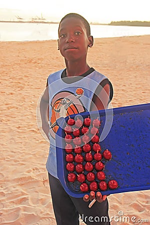 Local boy selling sweets at Boca Chica beach Editorial Stock Photo