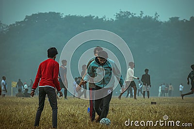 Local boys playing a soccer on a winter morning Editorial Stock Photo