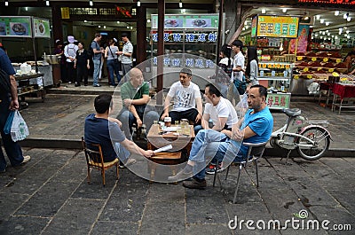 Local Chinese people drinking outside Editorial Stock Photo