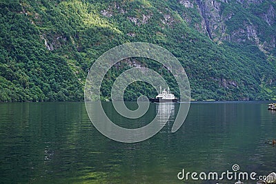 Local ferry boat operated in the large fjord in Aurland region. Stock Photo