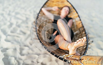 Local focus woman lying in hammock feet image. Feet skin health concept Stock Photo