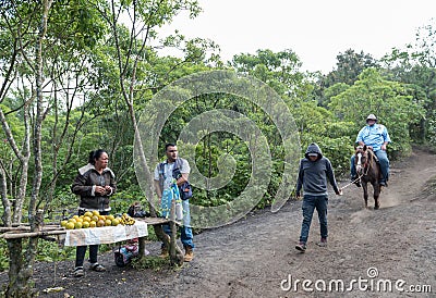 GUATEMALA - NOVEMBER 10, 2017: Local Fruit Store on the way to Pacaya Volcano in Guatemala. Horse service in Background. Editorial Stock Photo