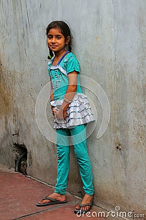 Local girl standing by the house in Fatehpur Sikri, Uttar Pradesh, India Editorial Stock Photo