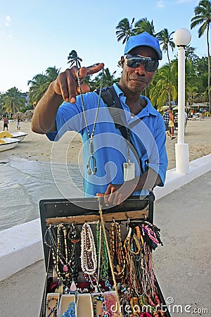 Local man selling jewelry at Boca Chica beach Editorial Stock Photo