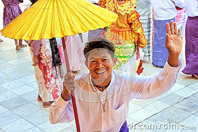 Local man in traditional costumes taking part in wedding ceremony at Mahamuni Pagoda, Mandalay, Myanmar. Editorial Stock Photo