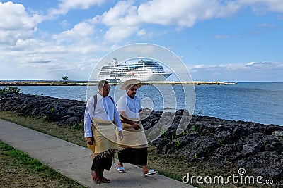 Local men walking at the waterfront in Nuku`alofa on Tongatapu i Editorial Stock Photo