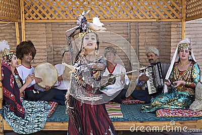 Local musicians and dancing woman, in Khiva, Uzbekistan Editorial Stock Photo