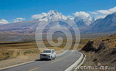 Local people driving across the breathtaking plains of the Himalayan Plateau. Editorial Stock Photo