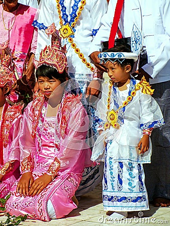 Local people in traditional costumes taking part in wedding ceremony at Mahamuni Pagoda, Mandalay, Myanmar Editorial Stock Photo