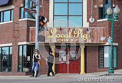 Local pig hotel and a police street patrol in Kansas City, the USA Editorial Stock Photo