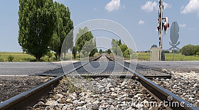 Local railway with the asphalt road crossing in a countryside, Afyonkarahisar, Turkey Stock Photo