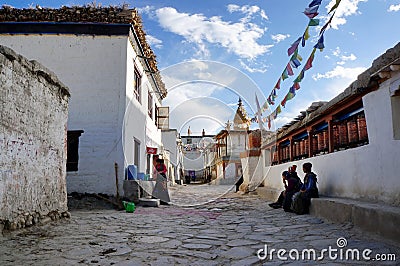 Nepal. Local residents in the Lo Manthang village streets in the day are engaged in their own affairs. Editorial Stock Photo