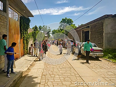 Local residents walking in the Calenda San Pedro in Oaxaca, Mexico. Editorial Stock Photo