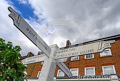 A local sign with pointing hands in Dulwich Village Stock Photo
