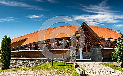 Local sports hall with curved rooftop on a hot summer day. Editorial Stock Photo