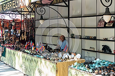 Armenia, Yerevan, September 2021. Vendor of local souvenirs and flags at the Vernissage market. Editorial Stock Photo