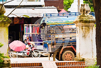 Local taxi on city street in Louangphabang, Laos. Copy space for text. Stock Photo