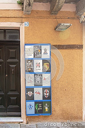 Local teeshirt prints street view details in La Maddalena Sardinia Italy Editorial Stock Photo