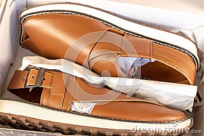 A local or traditional footwear Peshawari chappal in a shoebox closeup view Stock Photo