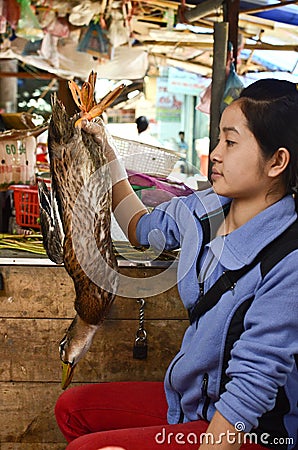 Local Vietnamese woman in a market Editorial Stock Photo