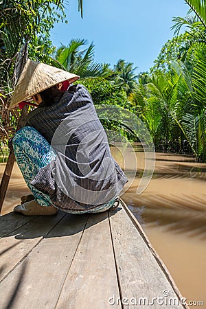 Local Woman Paddling Traditional Canoe Mekong Delta, Vietnam Editorial Stock Photo