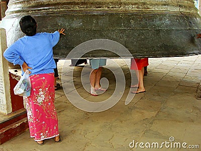Local woman standing by Mingun bell, Mandalay, Myanmar Editorial Stock Photo