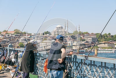 Locals fishing on the brigde over Golden Horn Editorial Stock Photo