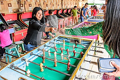 Locals play table football at Guatemalan village fair Editorial Stock Photo