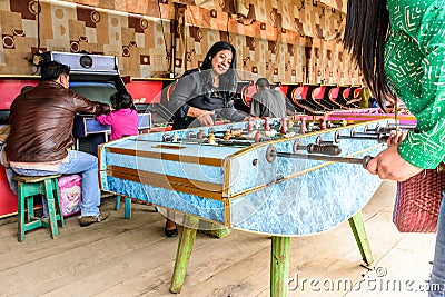 Locals play table football at Guatemalan village fair Editorial Stock Photo