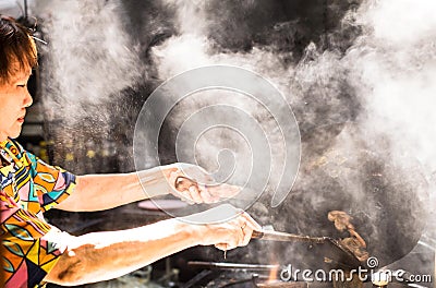Locals prepared food on the streets of Singapore Editorial Stock Photo