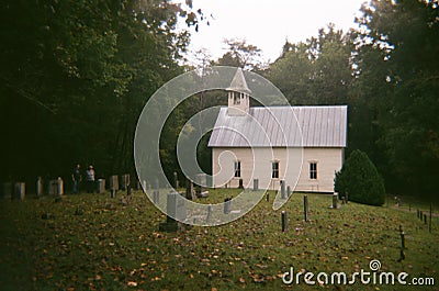 Old White Wooden Church With Graveyard Editorial Stock Photo