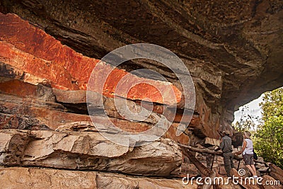 The Parkâ€™s Ranger of Kakadu National Park in Australia explaining about the rock painting in Ubirr. Editorial Stock Photo