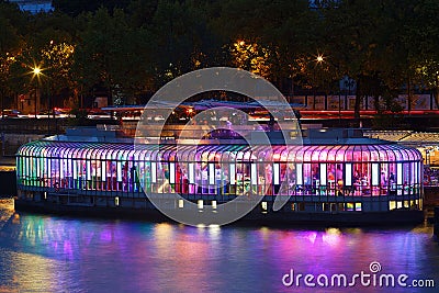 Located on the left bank of the Seine, the Rosa Bonheur guinguette boat on the Seine. The terrace offers a breathtaking Editorial Stock Photo