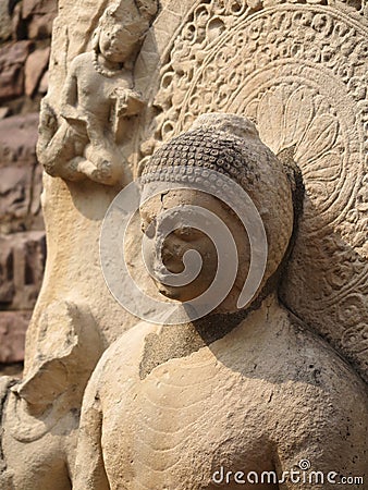 Close-up of ancient seated Buddha image along deambulatory pathway, Great Stupa, Sanchi Buddhist complex, Madhya Pradesh, India Editorial Stock Photo