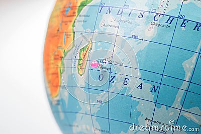 Location Reunion Island. Pink pin on the globe Stock Photo