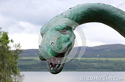 Loch Ness Monster statue with Loch Ness in the background Stock Photo