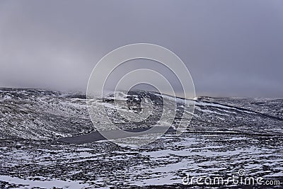 Loch Vrotachan on a cold bleak day on the Plateau above the Glenshee Ski Resort with the Sun trying to come out. Stock Photo