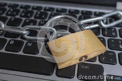 Lock with chain on computer keyboard. Data protection, privacy and security concept. Stock Photo