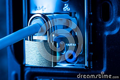 Lock hanging on a network cable Stock Photo