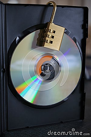 A lock on a storage disk symbolizing security of your data Stock Photo